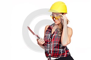 Young woman with hard hat and writing board