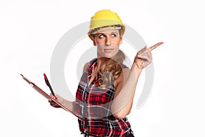 Young woman with hard hat and writing board