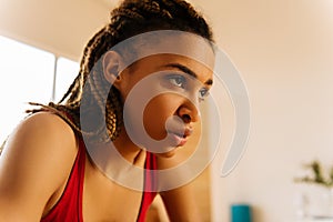 Young woman hardly breathing after intensive workout