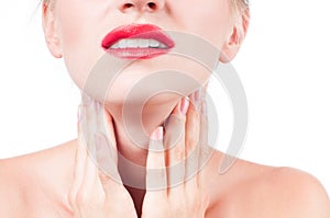 Young woman has sore throat touching the neck