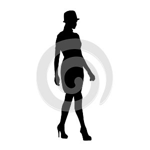 Young woman with hat walking, full body isolated vector silhouette photo
