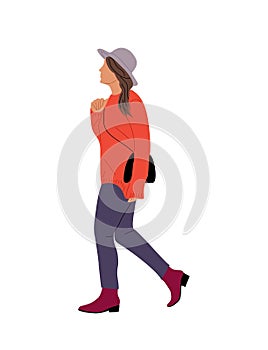 Young Woman in hat walking side view isolated.