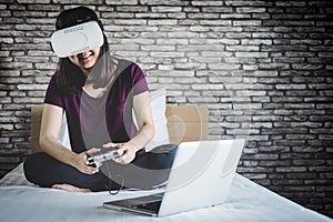 Young woman have fun in virtual reality headset or 3d glasses pl