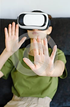 Young woman have fun in virtual reality headset or 3d glasses playing video game, gaming and technology concept. Close-up,