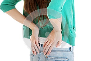 Young woman is having back pain.