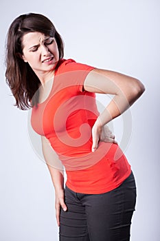 Young woman having back pain