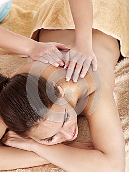Young woman having classical massage.