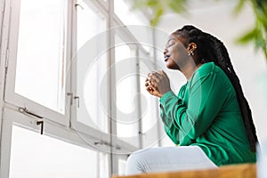 Young woman having a cup of coffee