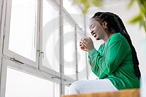 Young woman having a cup of coffee