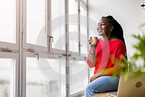 Young woman having a cup of coffee