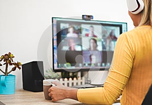 Young woman having a discussion meeting in video call with her team - Girl having chatting with friends on computer web app -