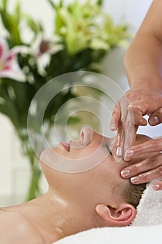 Young Woman Having Facial Massage Treatment
