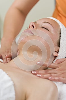 Young Woman Having Facial Treatment at Health Spa