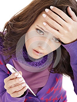 Young woman having flue taking thermometer.