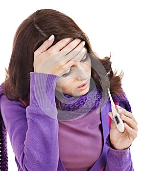 Young woman having flue taking thermometer.