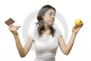 Young woman having a food dilemma photo