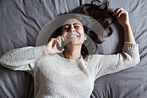 Young woman having a fun conversation on the phone