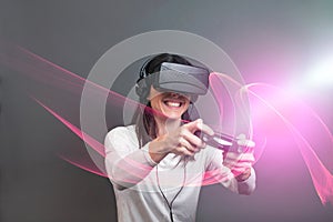 Young woman and having fun playing a virtual reality video game