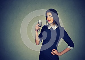 Young woman having glass of red wine