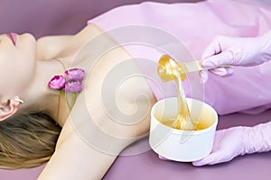 Young woman having hair removal procedure