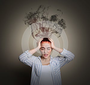 Young woman having headache on beige background. Illustration of smoke representing severe pain