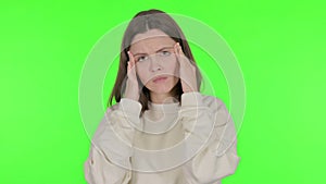 Young Woman Having Headache on Green Background