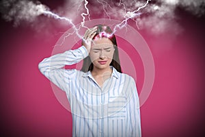 Young woman having headache on pink background. Illustration of lightnings representing severe pain