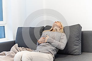 Young woman having heart attack