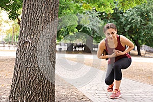 Young woman having heart attack while running