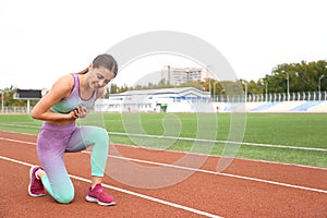 Young woman having heart attack while running