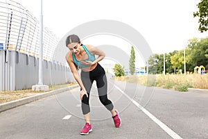 Young woman having heart attack while running