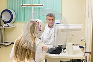 Young woman having her eyes examined by an eye