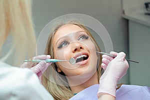 Young woman having medical checkup in the dentist office