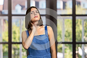 Young woman having neck pain.