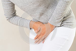 Young woman having painful stomachache