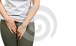 Young woman having painful stomachache with hands holding pressing her crotch lower abdomen