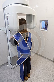 Young Woman Having Panoramic Digital X-ray Of Her Teeth