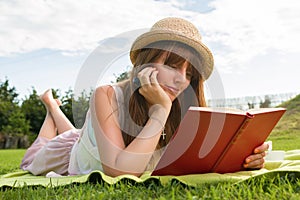 Young woman having picknic in park