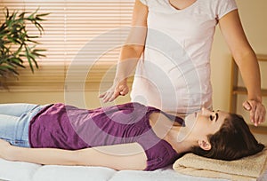 Young woman having a reiki treatment