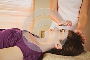 Young woman having a reiki treatment