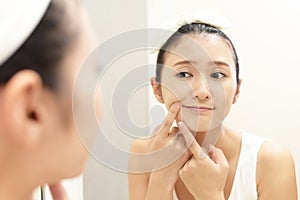 Young woman having skin problems