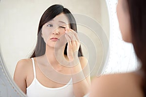 Young woman having skin problems