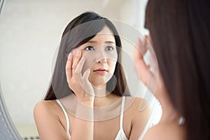 Young woman having skin problems