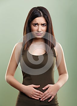 Woman having stomach abdominal pain photo