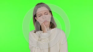 Young Woman Having Toothache on Green Background