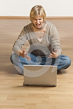 Young woman having trouble with her computer