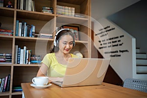 Young woman having video call via computer in the home office.Business video conferencing