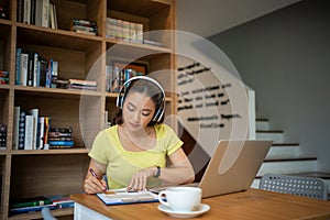 Young woman having video call via computer in the home office.Business video conferencing