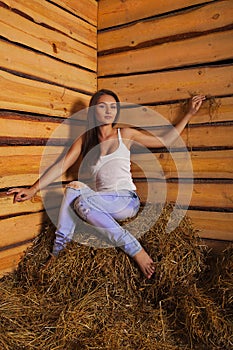 Young woman in a hayloft