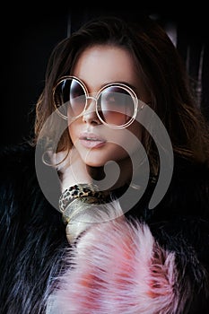 Young woman head shot, beautiful model portrait with big round sunglasses